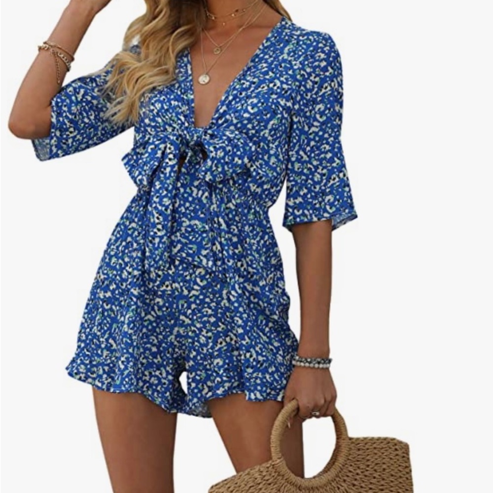 Never worn still in packaging small blue romper